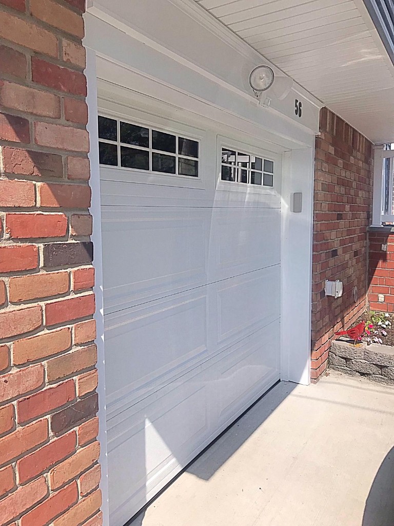 White garage door spring replacement - Nassau County